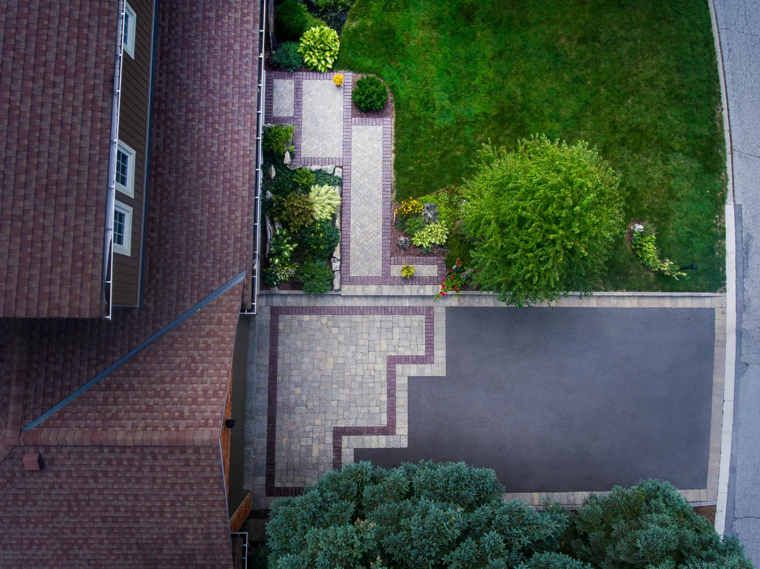 Top-down aerial view of the geometric front walkway and driveway edge in Ancaster.