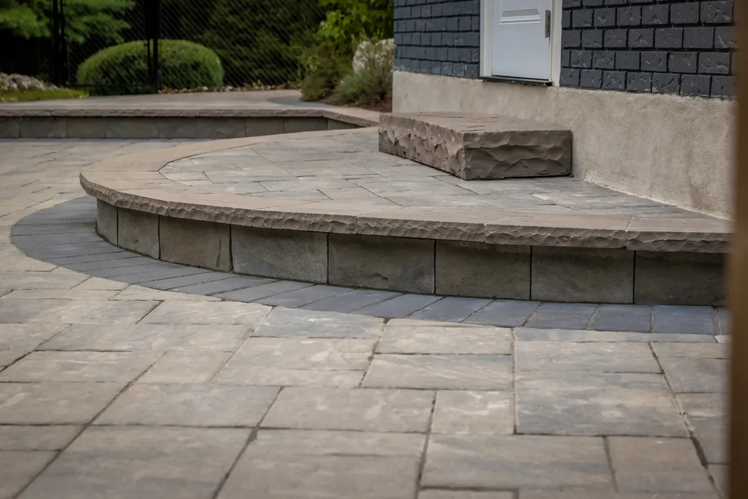 Curved raised step and interlock paving detail in Brantford.