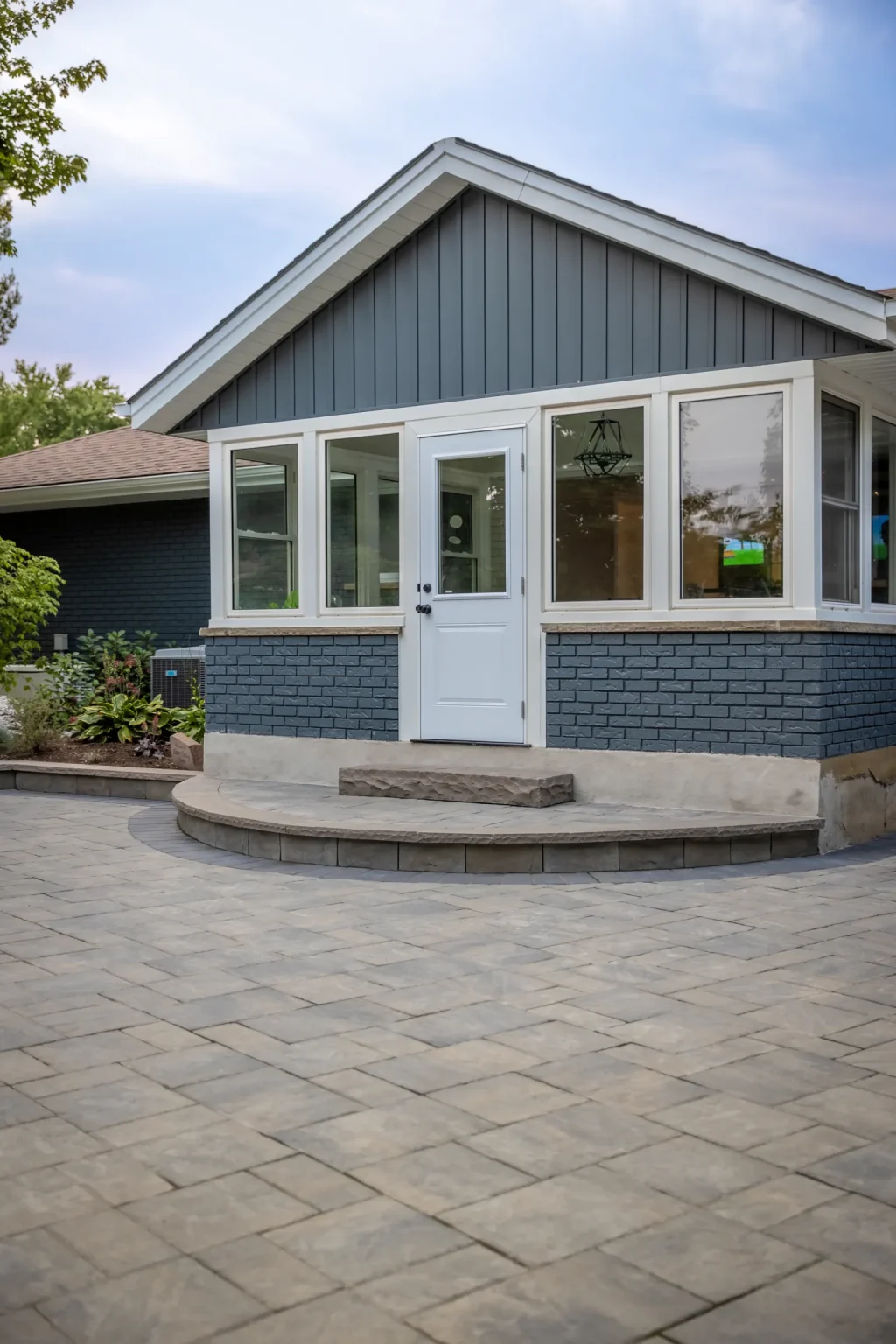 Rear entrance and curved patio steps in a completed Brantford backyard.