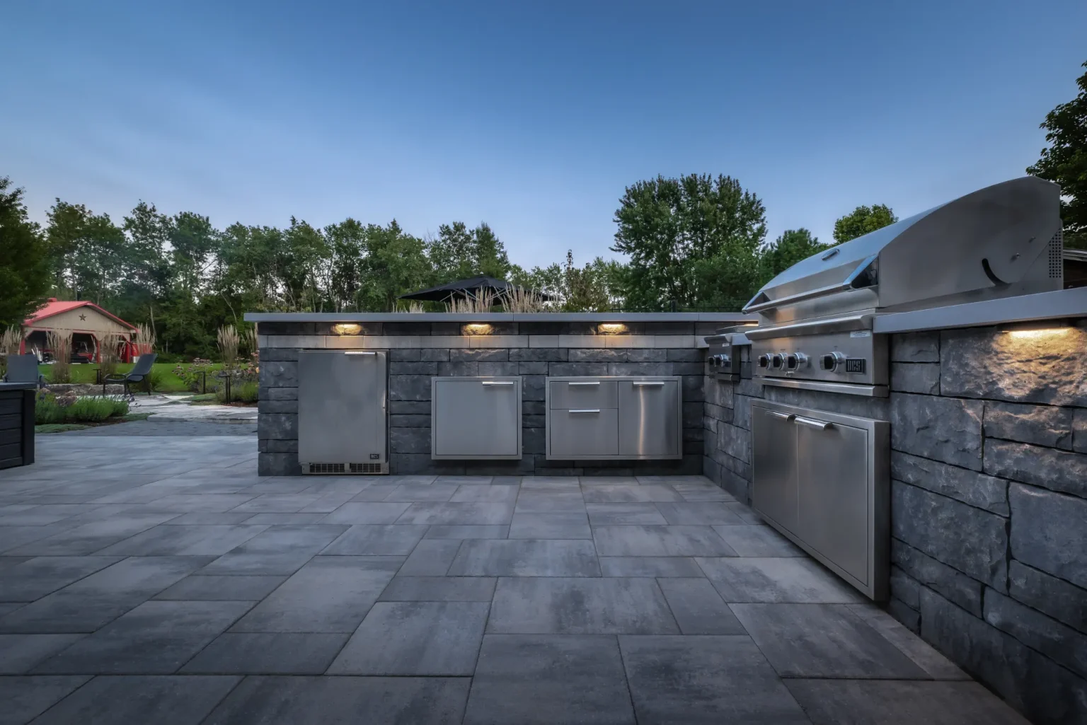 Wide frontal view of the outdoor kitchen and stainless appliances in Dundas.