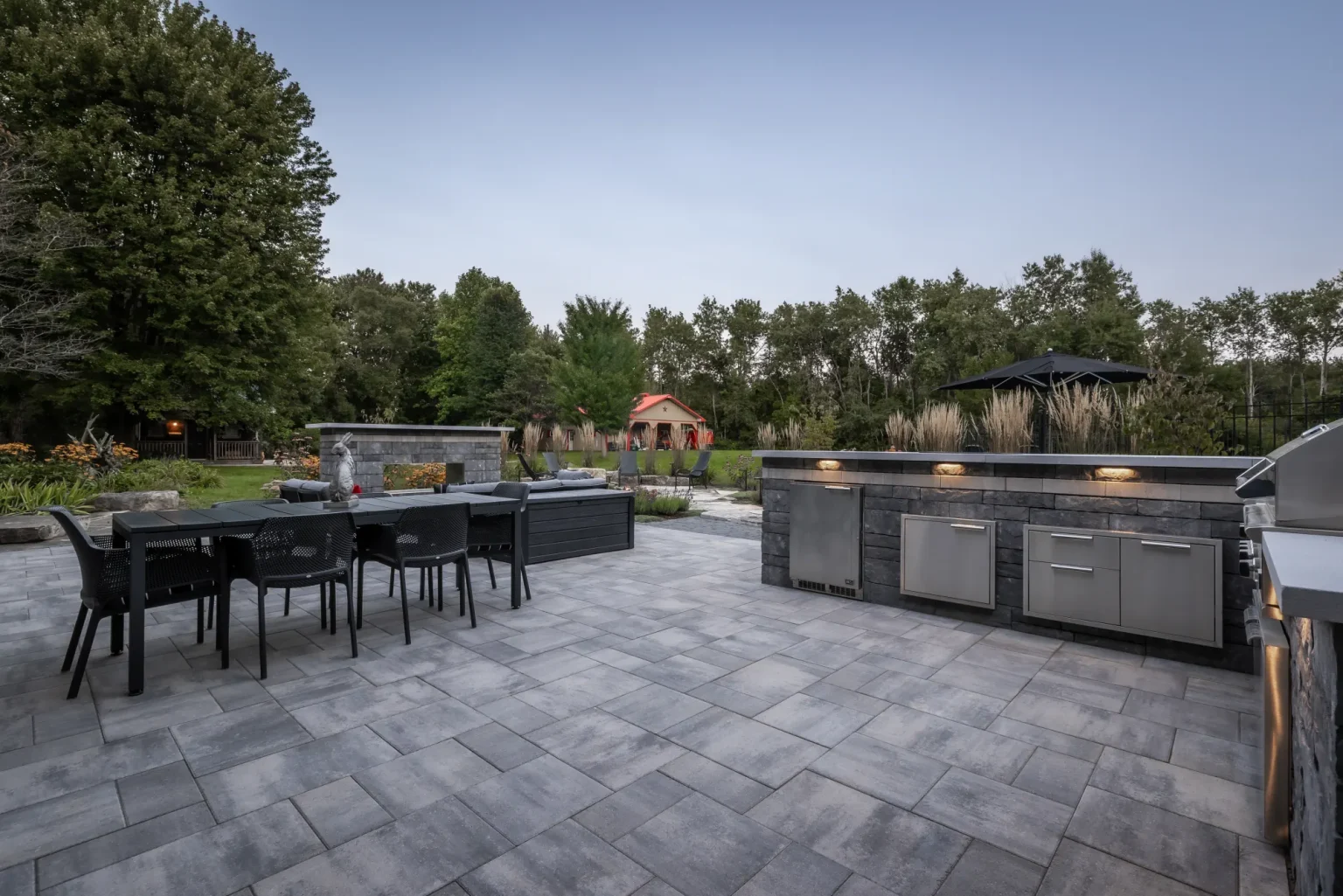 Wide patio view of the full outdoor kitchen and dining area in Dundas.