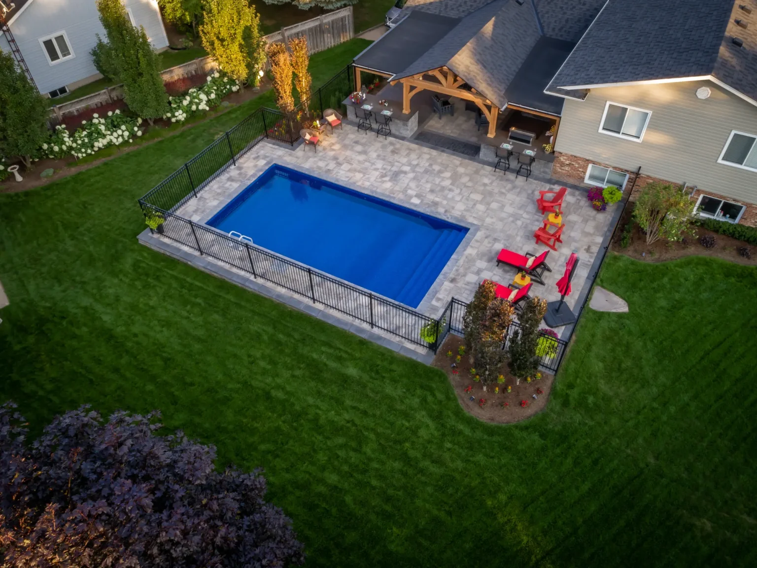 Aerial photograph of the Dundas pool, covered living area, patio and surrounding lawn.