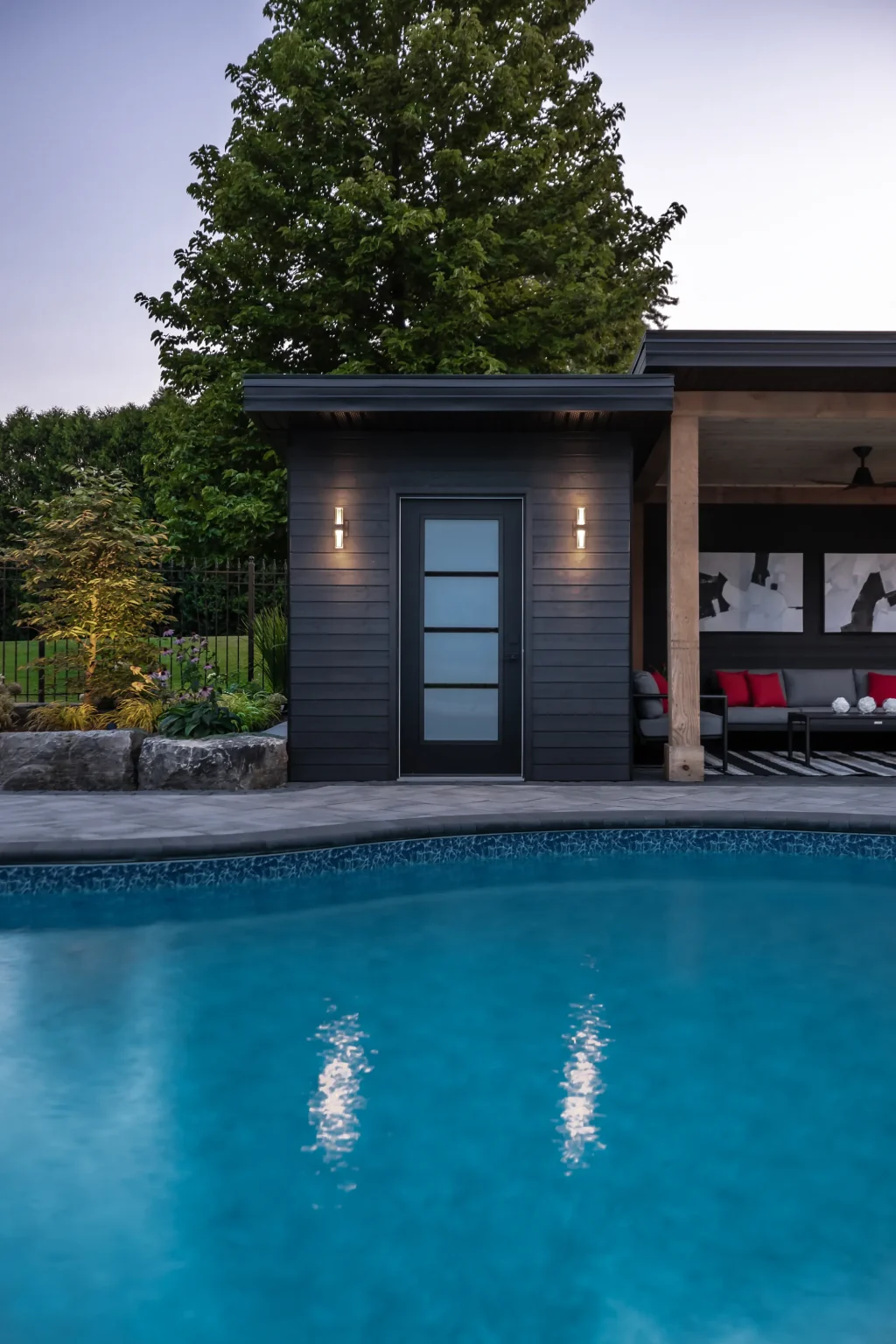 Portrait pool and cabana view after sunset in Dundas.