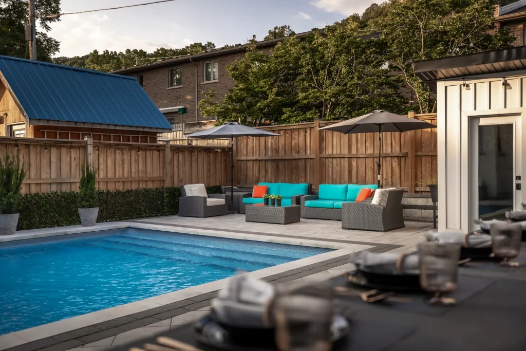 Pool view with lounge seating and outdoor bar elements framing the scene.
