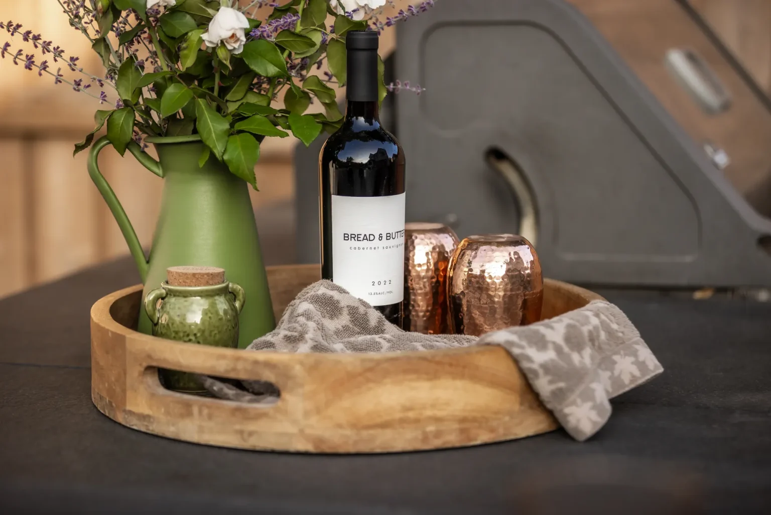 Styled wine and floral tray on the outdoor counter in Dundas.