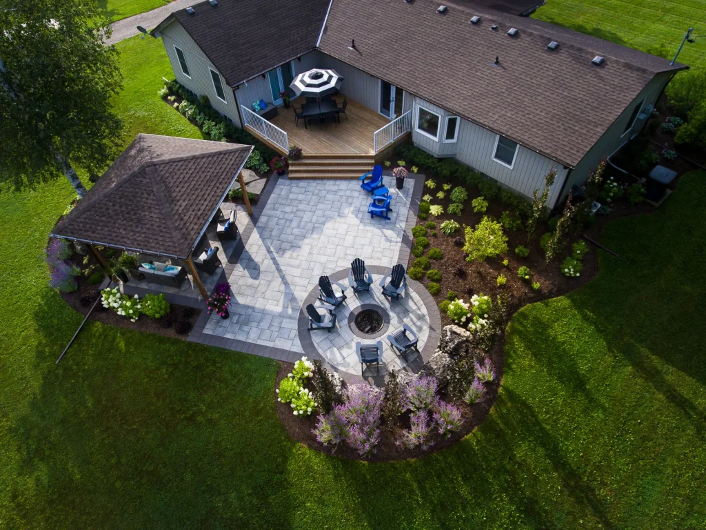 Aerial view of the full backyard patio connecting the house, pavilion and fire-pit circle in Flamborough.