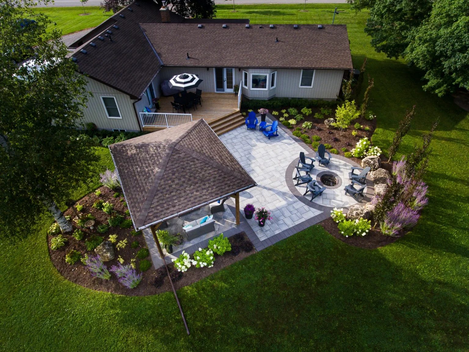 Oblique aerial overview of the pavilion, large paver patio and circular gathering area in Flamborough.