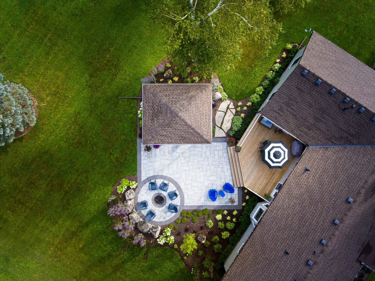 Direct overhead aerial view of the pavilion, paver patio and circular fire-pit area in Flamborough.