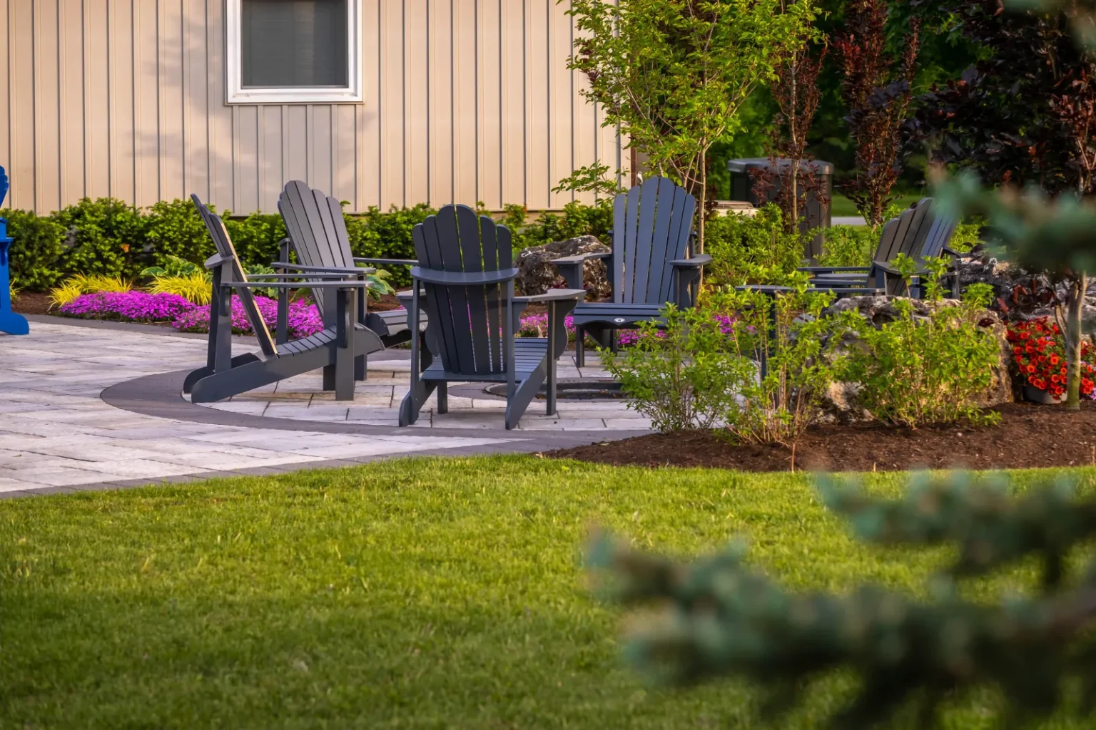 Patio seating area and garden border viewed across the lawn in Flamborough.