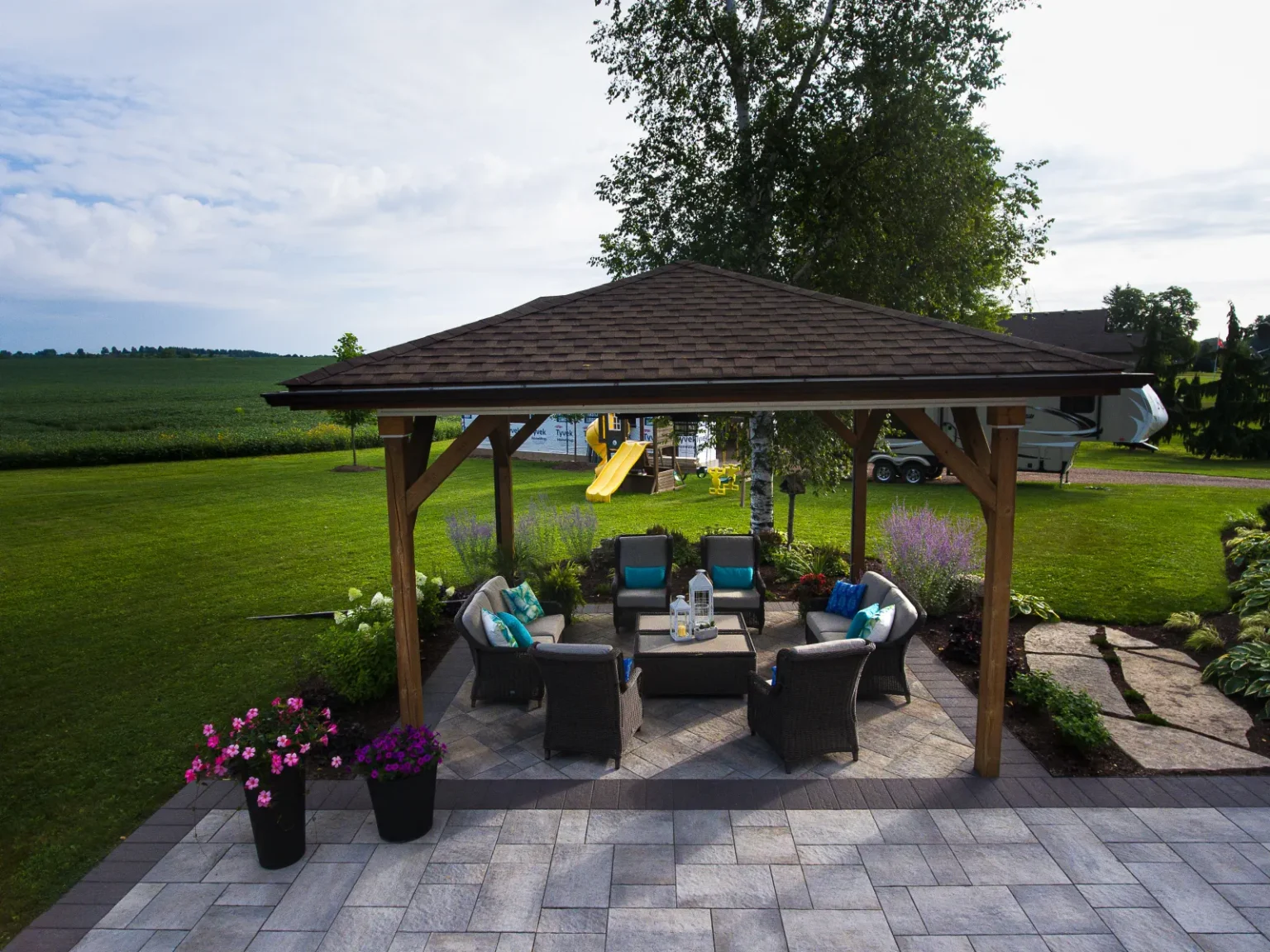 Straight-on view of the timber pavilion furnished as an outdoor lounge in Flamborough.